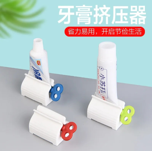 创意自动挤牙膏器懒人洗面奶按压器手动夹子创意手动卷牙膏器